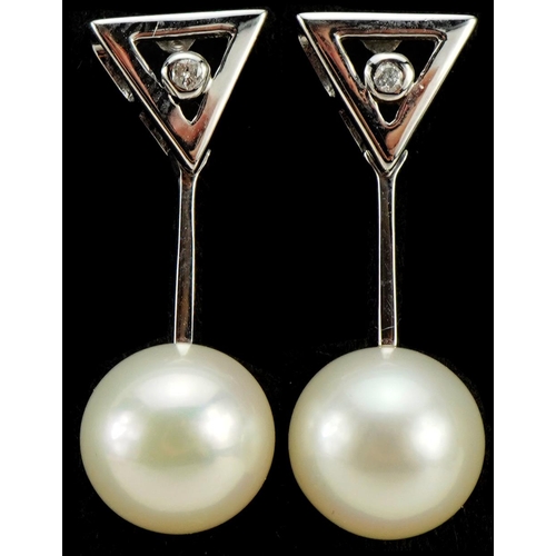 2239 - Pair of 9ct white gold pearl drop earrings, each set with a diamond, 2.3cm high, 2.9g