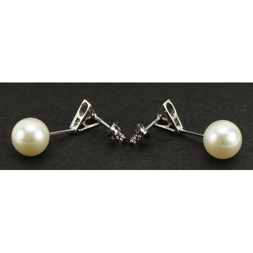 2239 - Pair of 9ct white gold pearl drop earrings, each set with a diamond, 2.3cm high, 2.9g