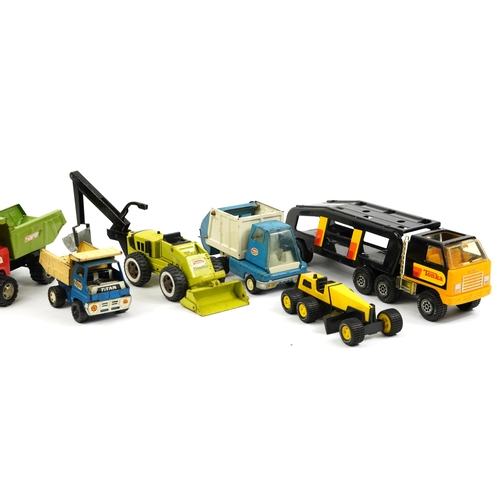 479 - Nine vintage tinplate and diecast vehicles including Tonka, the largest 48cm in length