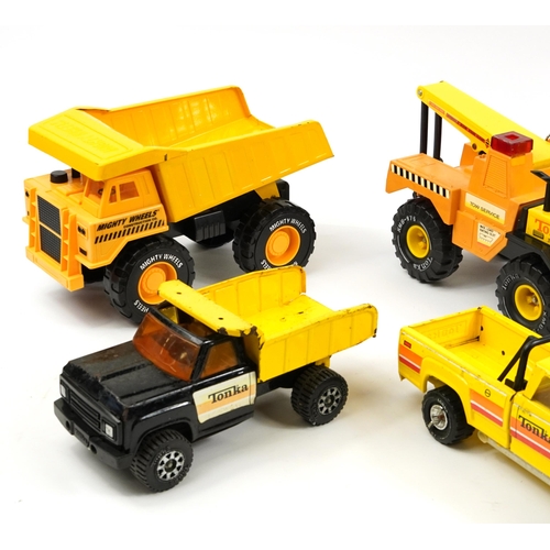 451 - Six vintage tinplate construction vehicles including Tonka, the largest 65cm high