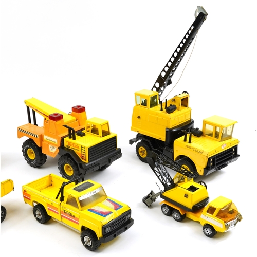 451 - Six vintage tinplate construction vehicles including Tonka, the largest 65cm high