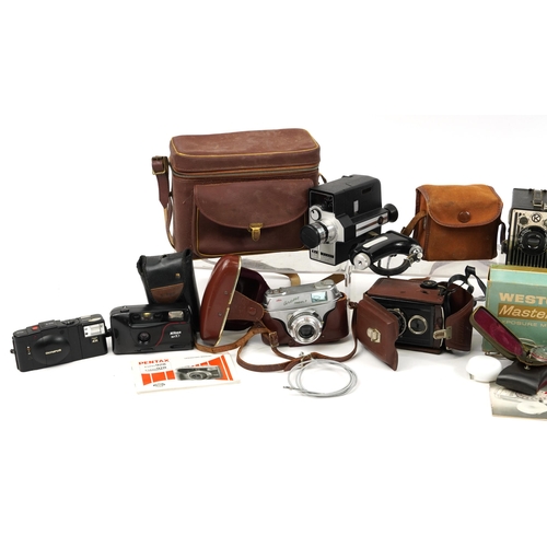 423 - Vintage and later cameras, lenses and accessories including Pentax, Nikon, Bell & Howell and Sima