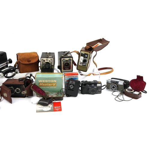 423 - Vintage and later cameras, lenses and accessories including Pentax, Nikon, Bell & Howell and Sima