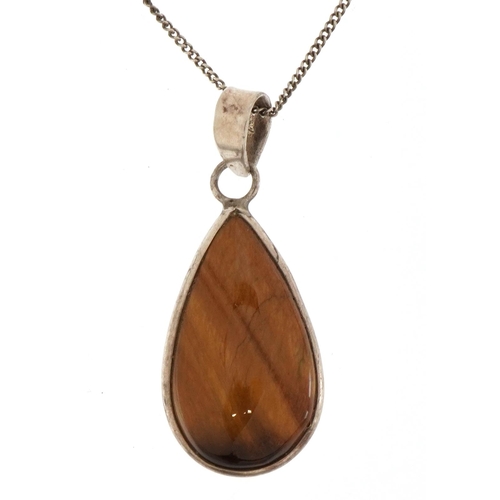 2635 - Silver tiger's eye pendant on chain stamped 925, 25cm in length, 9.1g