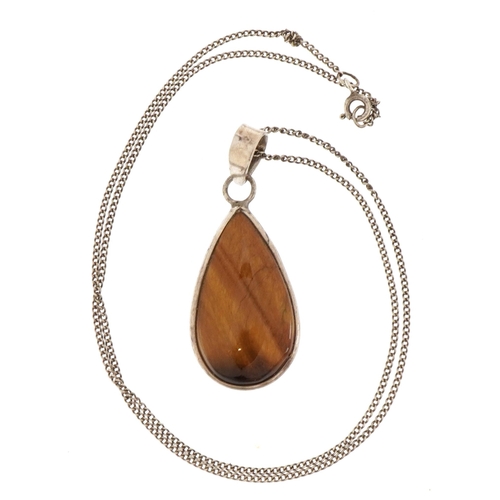 2635 - Silver tiger's eye pendant on chain stamped 925, 25cm in length, 9.1g