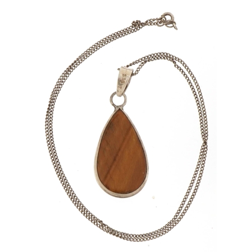 2635 - Silver tiger's eye pendant on chain stamped 925, 25cm in length, 9.1g