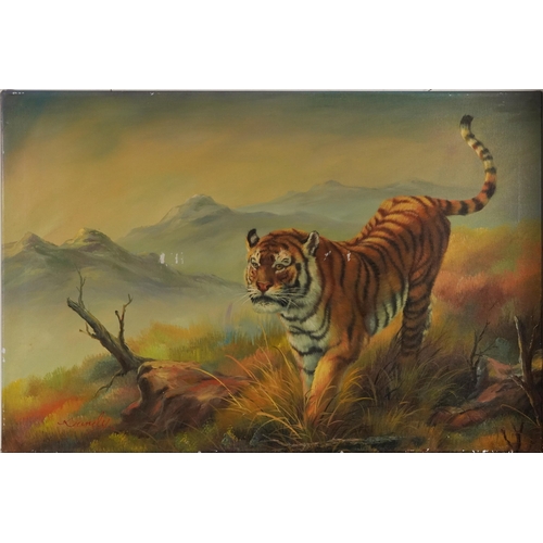 1327 - Tiger before a mountainous landscape, oil on canvas, indistinctly signed, possibly Bundy, unframed, ... 