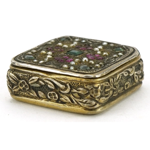 2684 - Continental 800 grade silver pillbox inset with rubies, emeralds, rubies and seed pearls, 2.1cm wide... 