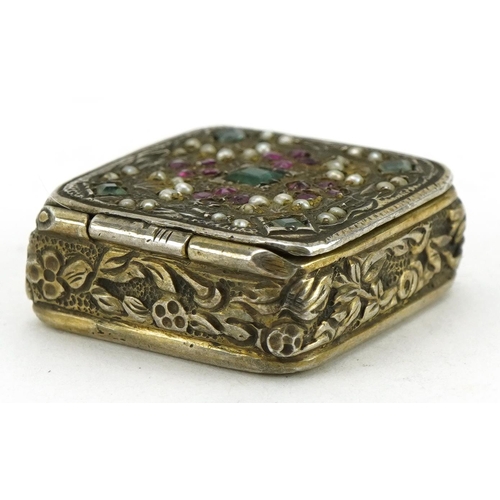 2684 - Continental 800 grade silver pillbox inset with rubies, emeralds, rubies and seed pearls, 2.1cm wide... 