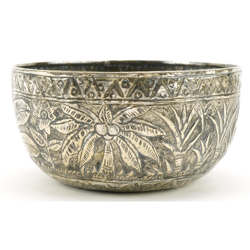 2781 - Chinese white metal bowl embossed with a geometric design and trees, 12cm in diameter, 88.9g