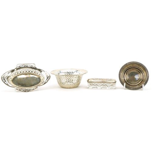 2779 - Silver objects comprising silver topped rectangular glass box and three dishes, two with pierced dec... 