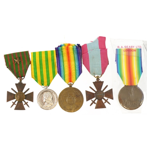 676 - Seven French military interest medals including Madagascar Commemorative and Madagascar medal