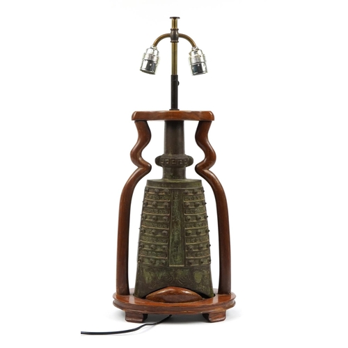 186 - Chinese archaic style patinated metal bell design twin table lamp with hardwood mounts, 39.5cm high