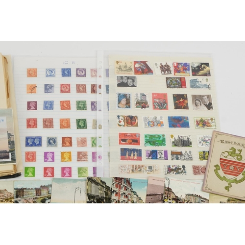 577 - Antique and later ephemera including topographical postcards and stamps arranged in an album