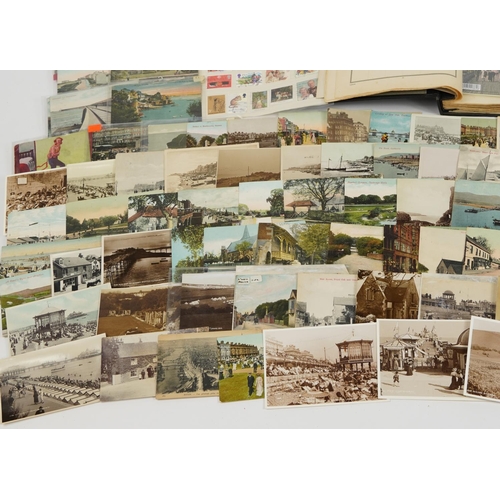 577 - Antique and later ephemera including topographical postcards and stamps arranged in an album