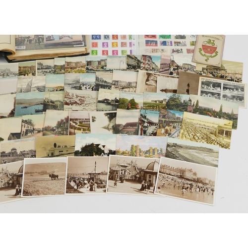 577 - Antique and later ephemera including topographical postcards and stamps arranged in an album