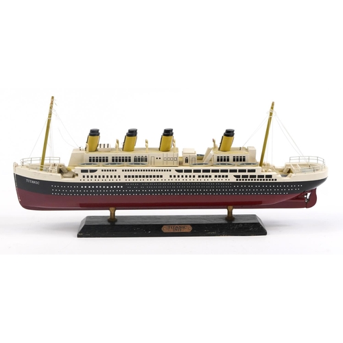 462 - Hand painted wooden model of the Titanic, 50cm in length