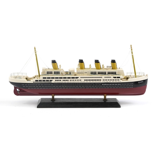 462 - Hand painted wooden model of the Titanic, 50cm in length