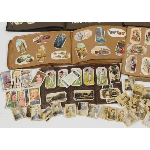 597 - Collection of cigarette cards, some arranged in albums including John Player & Sons Battalions, John... 