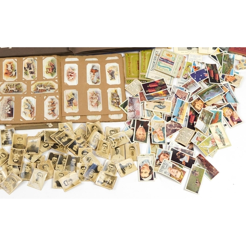 597 - Collection of cigarette cards, some arranged in albums including John Player & Sons Battalions, John... 