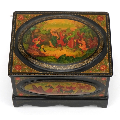 303 - Russian lacquered casket with hinged lid finely hand painted with five panels of merry figures withi... 