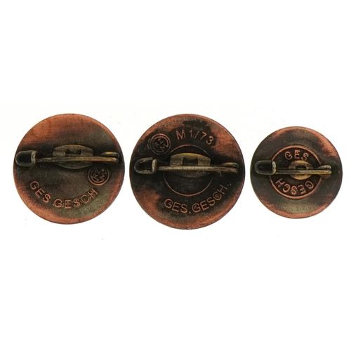 678 - Three German military interest badges, the largest 2.2cm in diameter