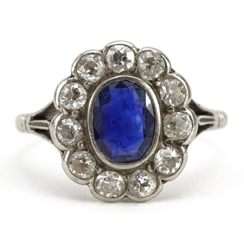 2006 - Art Deco unmarked white gold sapphire and diamond flower head ring with split shoulders housed in a ... 