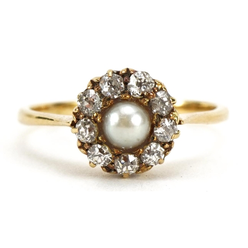 2051 - 18ct gold diamond and pearl flower head ring set with nine diamonds, the pearl approximately 4mm in ... 