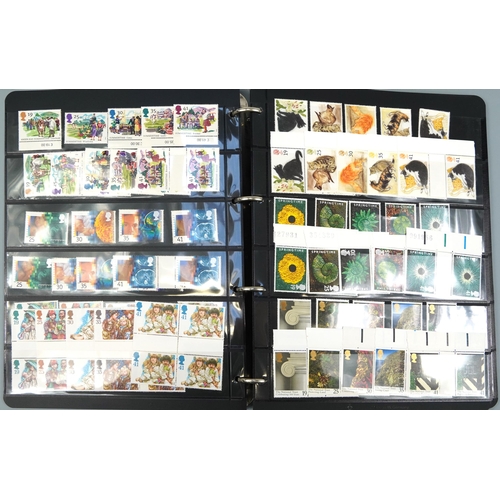 576 - Three albums of predominantly British mint unused stamps, various denominations and genres including... 