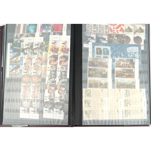 575 - Five albums of predominantly British mint unused stamps, various denominations and genres, some bloc... 