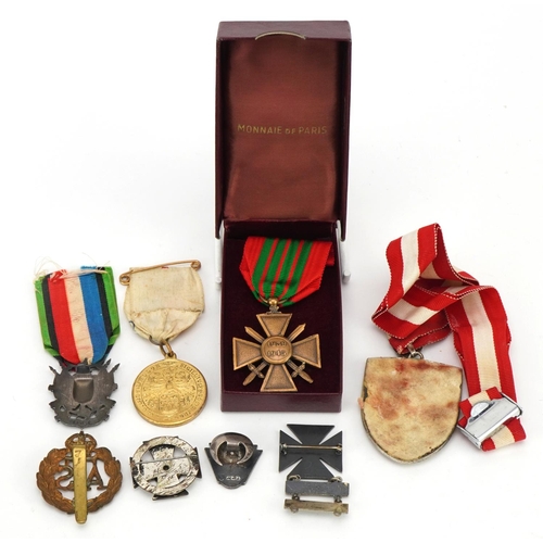 674 - British and foreign militaria and commemorative collectables including sterling silver Rifle & Grena... 