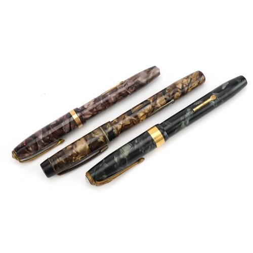 288 - Three vintage marbleised fountain pens including two Conway Stewart, each with gold nibs