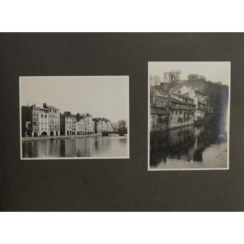 607 - Early 20th century European black and white photographs arranged in an album including bullfighting,... 