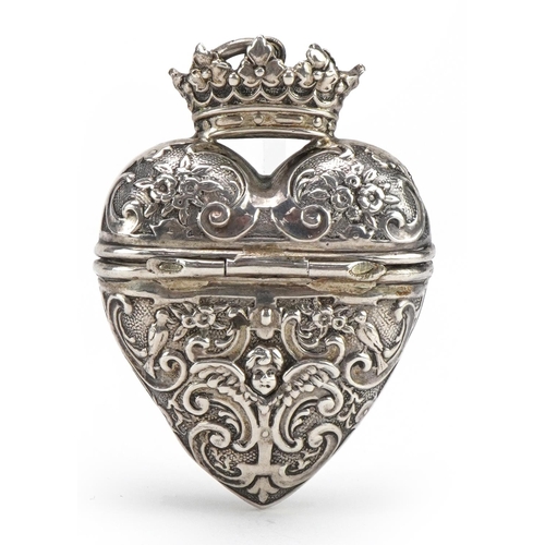 2738 - Unmarked silver love heart trinket pendant with hinged lid embossed with Putti and flowers, 5.5cm hi... 