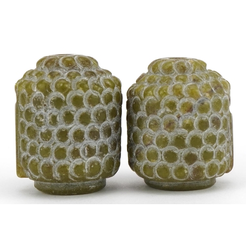 212 - Pair of Chinese green hardstone beads in the form of a Buddha head, 3cm high, 52.4g