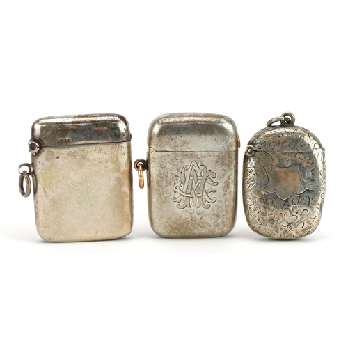 2729 - Three Edwardian and later silver vestas, one with engraved decoration, the largest 4.8cm high, total... 