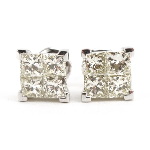 2005 - Pair of 18ct white gold Princess cut diamond earrings with screw backs housed in a tooled leather bo... 