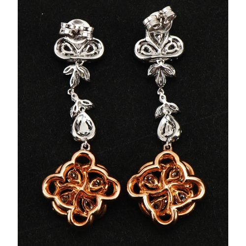 2081 - Pair of 18ct two tone gold chandelier style diamond drop earrings housed in a tooled leather box, to... 