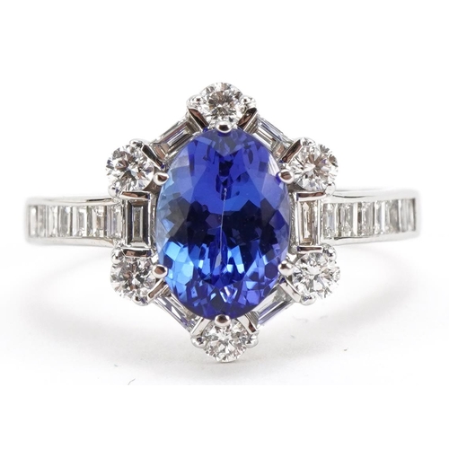 2022 - 18ct white gold tanzanite and diamond halo ring with baguette cut shoulders, total tanzanite weight ... 