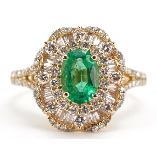 2059 - 14ct gold emerald and diamond cluster ring with diamond set split shoulders, total emerald weight ap... 