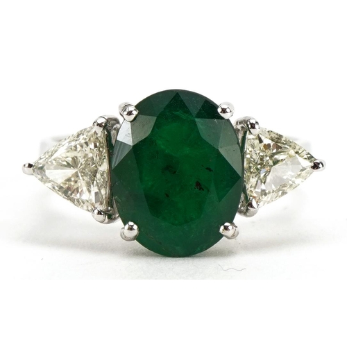 2074 - 18ct white gold emerald and diamond three stone ring, total emerald weight approximately 2.93 carat,... 