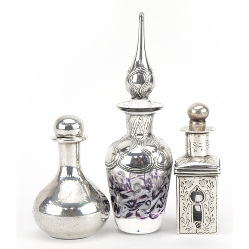 2743 - Three silver overlaid glass scent bottles with stoppers, the largest 13cm high