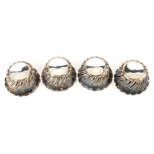 2686 - Lee & Wigfull, set of four Victorian circular silver open salts with embossed decoration, Sheffield ... 