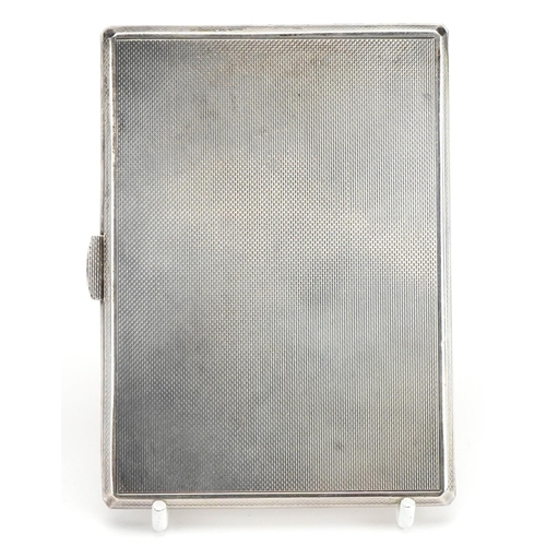 2769 - S J Rose & Son, Elizabeth II rectangular silver cigarette case with engine turned decoration and gil... 