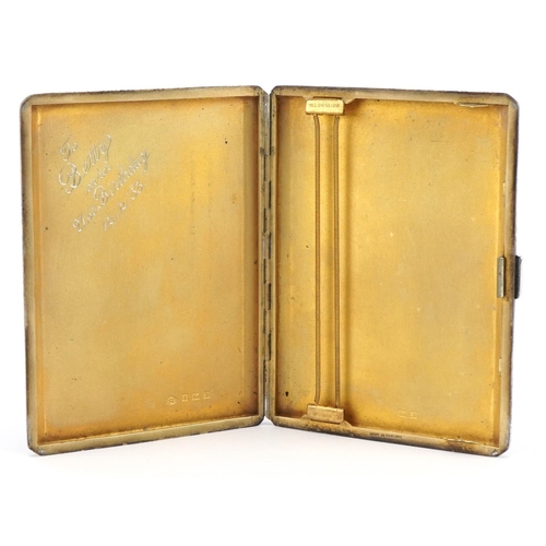 2674 - Elizabeth II rectangular silver cigarette case with engine turned decoration and gilt interior, Birm... 