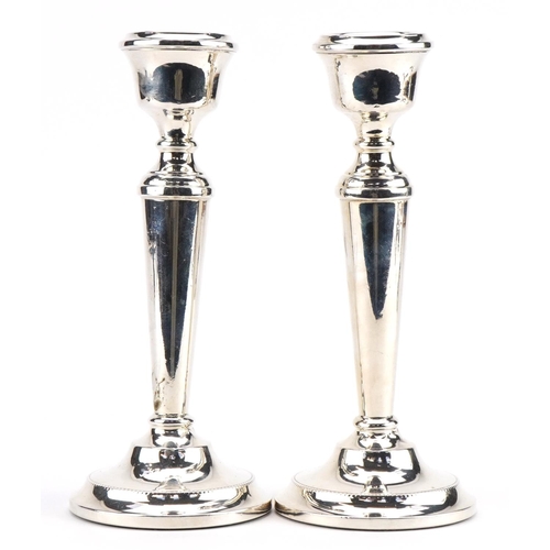 2670 - A T Cannon Ltd, pair of Elizabeth II silver tapering candlesticks, each 18.5cm high, total 417.3g