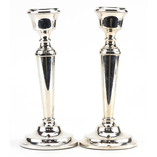 2670 - A T Cannon Ltd, pair of Elizabeth II silver tapering candlesticks, each 18.5cm high, total 417.3g