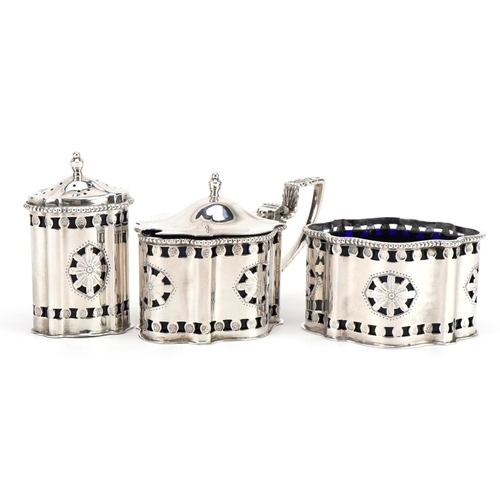 2665 - A Chick & Sons Ltd, Elizabeth II silver three piece cruet set with pierced decoration and blue glass... 