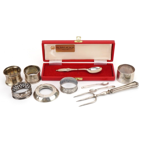 2765 - Silver and white metal objects including Elizabeth II Silver Jubilee spoon, napkin rings and a silve... 