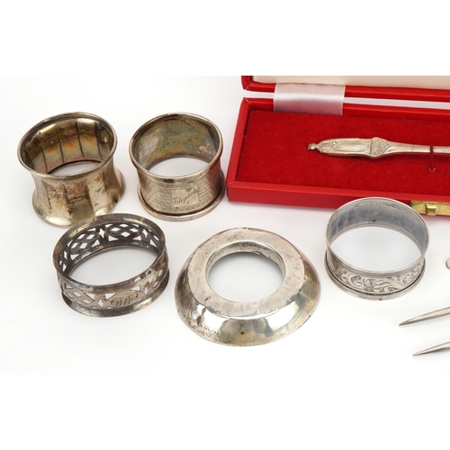 2765 - Silver and white metal objects including Elizabeth II Silver Jubilee spoon, napkin rings and a silve... 